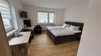 Ein Bett oder Betten in einem Zimmer der Unterkunft Gästehaus Fries