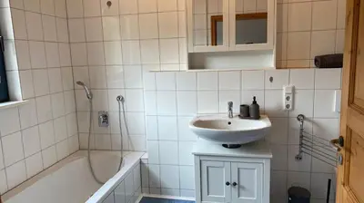 Ein Badezimmer in der Unterkunft Ferienwohnungen Park Café am Kurpark