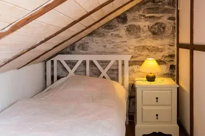 Ein Bett oder Betten in einem Zimmer der Unterkunft Zwergenschule