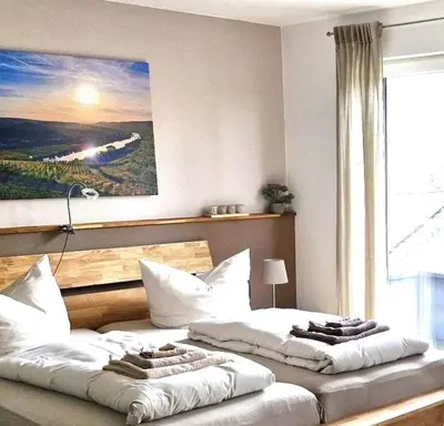 Ein Bett oder Betten in einem Zimmer der Unterkunft Mosel-Auszeit