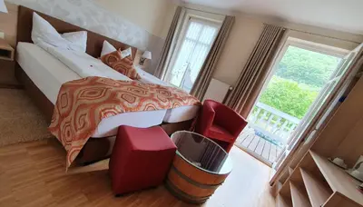 Ein Bett oder Betten in einem Zimmer der Unterkunft Hotel Zum Anker-THULLs Restaurant