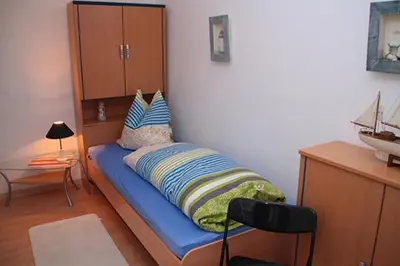 Ein Bett oder Betten in einem Zimmer der Unterkunft Ferienwohnung Helfenstein