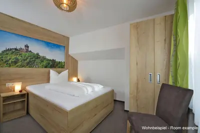 Ein Bett oder Betten in einem Zimmer der Unterkunft DORMERO Moselhotel Koblenz-Alken