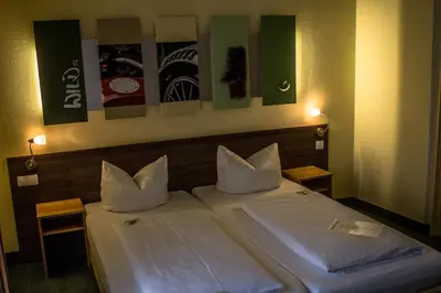 Ein Bett oder Betten in einem Zimmer der Unterkunft Gästehaus Blaue Ecke