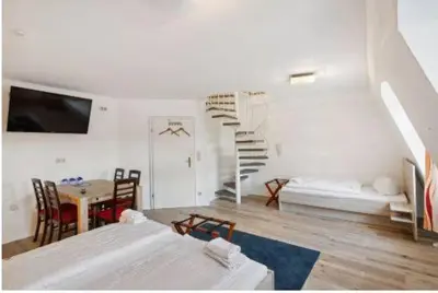 Ein Bett oder Betten in einem Zimmer der Unterkunft Gästehaus Blaue Ecke