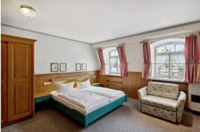 Ein Bett oder Betten in einem Zimmer der Unterkunft Gästehaus Blaue Ecke