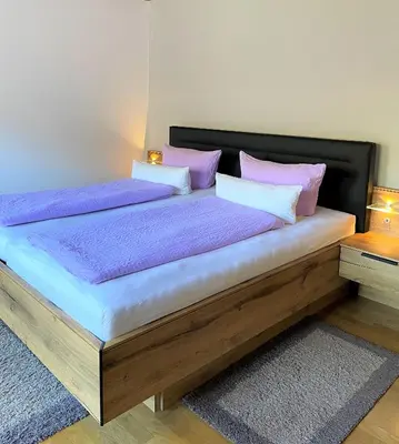Ein Bett oder Betten in einem Zimmer der Unterkunft Beilsteiner Gästehaus