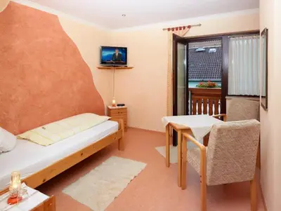 Ein Bett oder Betten in einem Zimmer der Unterkunft Hotel Garni Assion