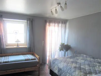 Ein Bett oder Betten in einem Zimmer der Unterkunft Wohnung auf einem alten Bauernhof