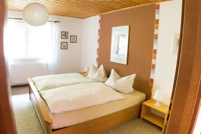 Ein Bett oder Betten in einem Zimmer der Unterkunft Ferienwohnungen Lithos