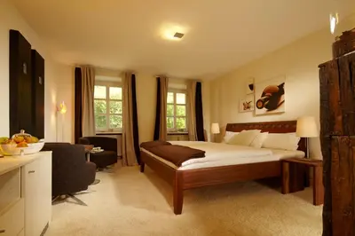 Ein Bett oder Betten in einem Zimmer der Unterkunft Wein- & Tafelhaus