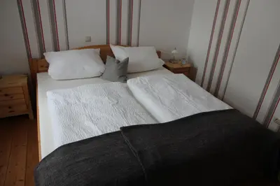 Ein Bett oder Betten in einem Zimmer der Unterkunft Ferienwohnung Meuser