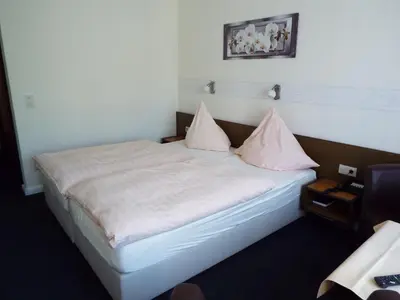 Ein Bett oder Betten in einem Zimmer der Unterkunft Park-Hotel