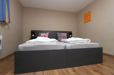 Ein Bett oder Betten in einem Zimmer der Unterkunft Ferienhaus Moselgasse