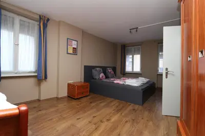 Ein Bett oder Betten in einem Zimmer der Unterkunft Ferienhaus Moselgasse