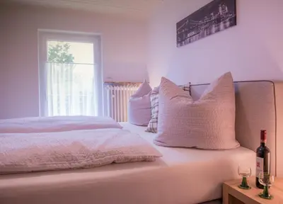 Ein Bett oder Betten in einem Zimmer der Unterkunft FeWo Goebel Beethovenstraße