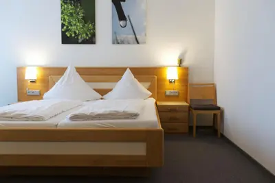 Ein Bett oder Betten in einem Zimmer der Unterkunft Weinhaus am Schieferfels