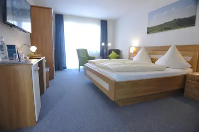 Ein Bett oder Betten in einem Zimmer der Unterkunft Weinhaus am Schieferfels