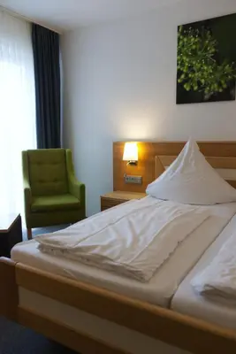 Ein Bett oder Betten in einem Zimmer der Unterkunft Weinhaus am Schieferfels
