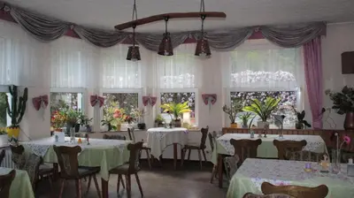 Ein Restaurant oder anderes Speiselokal in der Unterkunft Winzerschenke