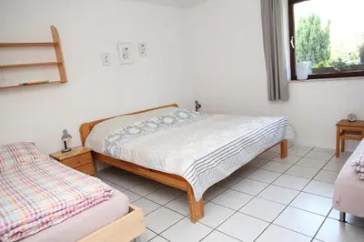 Ein Bett oder Betten in einem Zimmer der Unterkunft Ferienhaus am Maibüsch - rollstuhlgerecht
