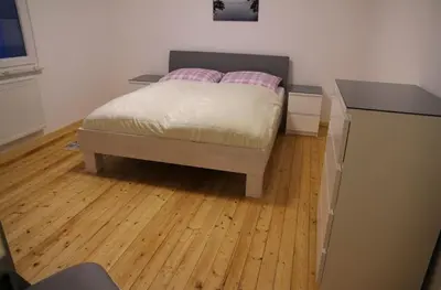 Ein Bett oder Betten in einem Zimmer der Unterkunft Ferienhaus am Kreuzberg - Nürburgring