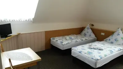Ein Bett oder Betten in einem Zimmer der Unterkunft Hotel Andernacher Hof