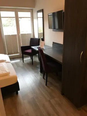 Ein Bett oder Betten in einem Zimmer der Unterkunft aparthotel Cochem