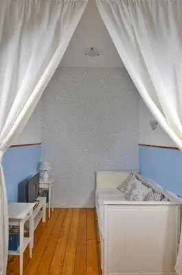 Ein Bett oder Betten in einem Zimmer der Unterkunft Altes Pfarrhaus Gondershausen