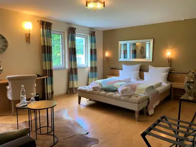 Ein Bett oder Betten in einem Zimmer der Unterkunft Das Landhaus Apartments