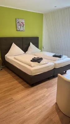 Ein Bett oder Betten in einem Zimmer der Unterkunft Bacharacher Hof