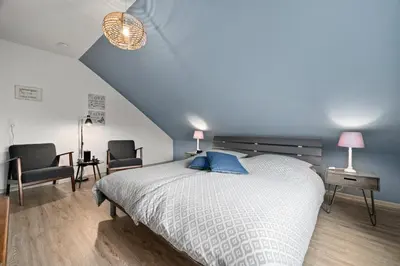 Ein Bett oder Betten in einem Zimmer der Unterkunft Gästehaus Hoxel