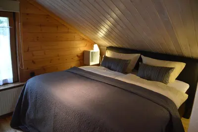 Ein Bett oder Betten in einem Zimmer der Unterkunft EIFELCOTTAGE Family 7