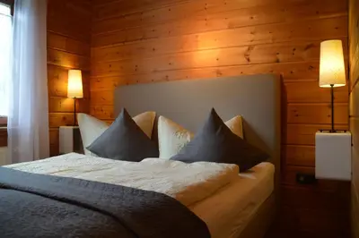 Ein Bett oder Betten in einem Zimmer der Unterkunft EIFELCOTTAGE Family 9