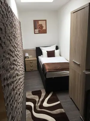 Ein Bett oder Betten in einem Zimmer der Unterkunft Hotel am Brünnchen