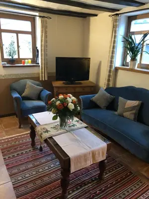 Ein Sitzbereich in der Unterkunft Hommes Haus