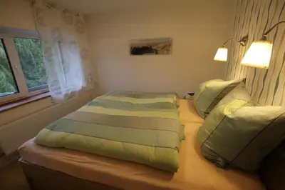 Ein Bett oder Betten in einem Zimmer der Unterkunft Burbergblick