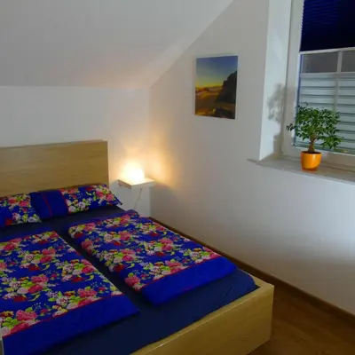 Ein Bett oder Betten in einem Zimmer der Unterkunft Cochem Ferienwohnung Scheuer