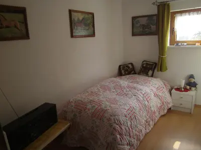 Ein Bett oder Betten in einem Zimmer der Unterkunft Ferienwohnung Barzen
