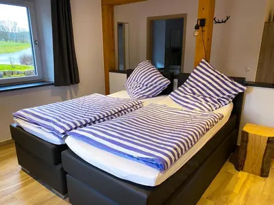 Ein Bett oder Betten in einem Zimmer der Unterkunft Beim Hooch 