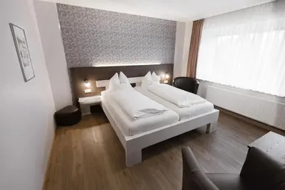 Ein Bett oder Betten in einem Zimmer der Unterkunft Gästehaus Wein im Turm