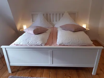 Ein Bett oder Betten in einem Zimmer der Unterkunft Cafe-Konditorei-Pension Sander