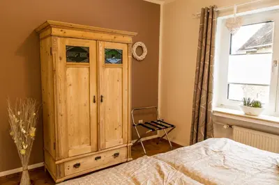 Ein Bett oder Betten in einem Zimmer der Unterkunft Haus Burgfee - Obere Etage
