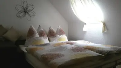 Ein Bett oder Betten in einem Zimmer der Unterkunft Haus Madle