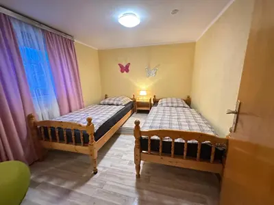 Ein Bett oder Betten in einem Zimmer der Unterkunft Kleine Pearl