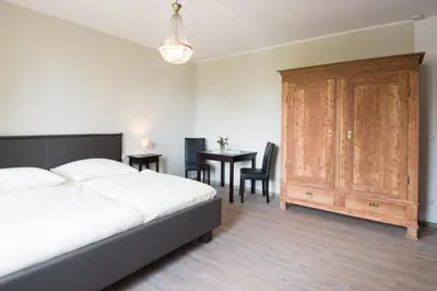 Ein Bett oder Betten in einem Zimmer der Unterkunft Altes Forsthaus