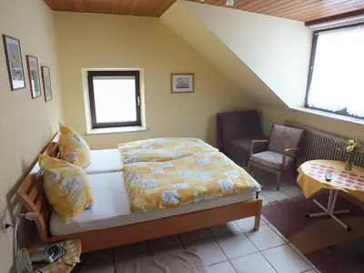 Ein Bett oder Betten in einem Zimmer der Unterkunft Gästehaus Neises
