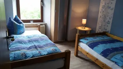 Ein Bett oder Betten in einem Zimmer der Unterkunft Kleines Ferienhaus Nicole