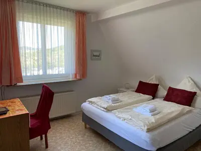 Ein Bett oder Betten in einem Zimmer der Unterkunft Haus Adams - das Wohlfühl Gästehaus