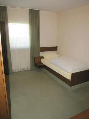 Ein Bett oder Betten in einem Zimmer der Unterkunft Gästehaus Rehwinkel
